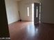 Cozy living room with bright entry door and durable laminate flooring for easy maintenance and style at 1929 Evelyn Ave, Henderson, NV 89011