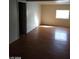 Bright living room with wood-look floors and natural light at 1929 Evelyn Ave, Henderson, NV 89011
