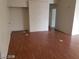 Open-concept living room with laminate wood flooring and neutral walls at 1929 Evelyn Ave, Henderson, NV 89011