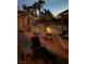 Cozy backyard featuring a fire pit, seating area, and desert landscaping at 492 Sunset Villa Dr, Las Vegas, NV 89110