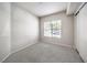 Well-lit bedroom with carpet flooring and window at 50 E Serene Ave # 107, Las Vegas, NV 89123