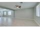 Living room with tile floors, ceiling fan, and neutral walls at 10137 Skye Saddle Ave, Las Vegas, NV 89166