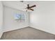 Bright bedroom with ceiling fan and neutral carpeting at 108 Almendio Ln, Henderson, NV 89074