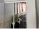 Bedroom closet with sliding mirror doors reflecting a bedroom with a tufted headboard bed at 2305 W Horizon Ridge Pkwy # 3512, Henderson, NV 89052