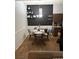 Charming dining area features black accent wall with decorative shelves and a table with seating for four at 2305 W Horizon Ridge Pkwy # 3512, Henderson, NV 89052