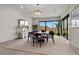 Elegant dining room with a large wooden table and access to the backyard at 21 Canyon Bay Dr, Henderson, NV 89011