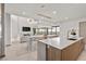 Modern kitchen with large island and stainless steel appliances at 21 Canyon Bay Dr, Henderson, NV 89011