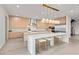 Modern kitchen with a large island and contemporary light wood cabinets at 21 Canyon Bay Dr, Henderson, NV 89011