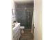 Bathroom with a modern tiled shower and vanity with white cabinets for a refreshing space at 3909 Woodhill Ave, Las Vegas, NV 89121