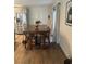 Dining area adjacent to the kitchen, featuring a wooden table and stainless steel appliances at 3909 Woodhill Ave, Las Vegas, NV 89121