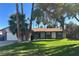 Charming single-story home with well-maintained lawn and mature trees providing ample shade at 3909 Woodhill Ave, Las Vegas, NV 89121