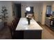 Kitchen island with chairs, quartz counters, pendant lights, and views of the open-concept floor plan at 3909 Woodhill Ave, Las Vegas, NV 89121