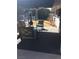 Relaxing patio area with comfortable seating overlooking the backyard and pool at 3909 Woodhill Ave, Las Vegas, NV 89121