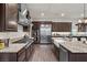 Gourmet kitchen with stainless steel appliances and granite counters at 4169 San Capri Way, Las Vegas, NV 89141