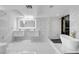 Modern bathroom with double sink vanity, walk-in shower, and soaking tub at 6315 N El Capitan Way, Las Vegas, NV 89149