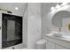 Modern bathroom with black and white marble tile, walk-in shower, and vanity at 6315 N El Capitan Way, Las Vegas, NV 89149