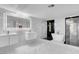 Modern bathroom with double sink vanity, walk-in shower, and soaking tub at 6315 N El Capitan Way, Las Vegas, NV 89149