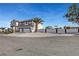 Two-story stucco home with a two car garage and desert landscaping at 6315 N El Capitan Way, Las Vegas, NV 89149