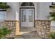 Close up of the front door of a home with stone accents at 6315 N El Capitan Way, Las Vegas, NV 89149
