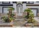 Stone steps lead to the double door entry of this two-story home at 6315 N El Capitan Way, Las Vegas, NV 89149