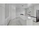 Bright kitchen features white cabinets, marble backsplash, and a center island at 6315 N El Capitan Way, Las Vegas, NV 89149