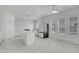 Modern kitchen with white cabinets, marble countertops, and stainless steel appliances at 6315 N El Capitan Way, Las Vegas, NV 89149