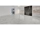 Large living room with marble floors, black marble fireplace, and a balcony at 6315 N El Capitan Way, Las Vegas, NV 89149