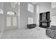 Bright living room boasts high ceilings, marble floors, and a modern fireplace feature at 6315 N El Capitan Way, Las Vegas, NV 89149