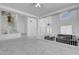 Elegant living area with high ceilings, modern chandelier, and marble tile flooring at 6315 N El Capitan Way, Las Vegas, NV 89149