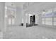 Bright living room features high ceilings, marble floors, and a modern fireplace at 6315 N El Capitan Way, Las Vegas, NV 89149