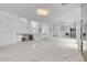 Open floor plan showcasing marble floors, staircase, and wet bar at 6315 N El Capitan Way, Las Vegas, NV 89149