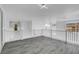 Open and airy loft area with railing and hardwood floors at 6315 N El Capitan Way, Las Vegas, NV 89149