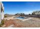Inviting backyard pool with concrete surround and privacy wall at 6315 N El Capitan Way, Las Vegas, NV 89149