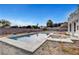 Inviting backyard pool with concrete surround and desert landscaping at 6315 N El Capitan Way, Las Vegas, NV 89149