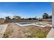 Inviting backyard pool with concrete surround and desert landscaping at 6315 N El Capitan Way, Las Vegas, NV 89149