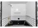 Elegant bathtub with black and white tile surround at 3125 Pinehurst Dr # A, Las Vegas, NV 89109