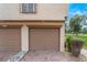 Attached garage with brick driveway and low-maintenance landscaping at 3125 Pinehurst Dr # A, Las Vegas, NV 89109