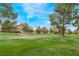 Scenic view of the golf course, lush green lawns, trees, and the Stratosphere in the background at 3125 Pinehurst Dr # A, Las Vegas, NV 89109