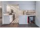 Kitchen with tile countertops and floors, white cabinets, and modern appliances at 3125 Pinehurst Dr # A, Las Vegas, NV 89109