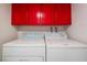 Bright laundry room featuring a white washer and dryer with storage above at 3125 Pinehurst Dr # A, Las Vegas, NV 89109