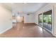 Spacious living room with tile floors and a sliding glass door to outdoor area at 3125 Pinehurst Dr # A, Las Vegas, NV 89109