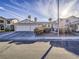 House exterior featuring a two-car garage and landscaping at 6209 Peggotty Ave, Las Vegas, NV 89130