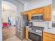 Kitchen with stainless steel appliances and oak cabinets at 6209 Peggotty Ave, Las Vegas, NV 89130