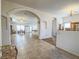 Open living room with tile floors and arched entryway at 6209 Peggotty Ave, Las Vegas, NV 89130