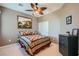 Comfortable bedroom with a ceiling fan, closet, and a decorative quilt on the bed at 6868 Sky Pointe Dr # 2039, Las Vegas, NV 89131