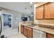 Cozy kitchen with views into the living room and stainless steel dishwasher at 6868 Sky Pointe Dr # 2039, Las Vegas, NV 89131