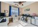 Bright office space with dual workstations, natural light, and ample storage at 6868 Sky Pointe Dr # 2039, Las Vegas, NV 89131