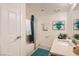 Clean bathroom with vanity, tub, and teal accents at 1636 Justin Cir # 0, Henderson, NV 89011