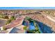 Aerial view of house with pool and solar panels, nestled in a residential neighborhood at 2112 Silent Echoes Dr, Henderson, NV 89044