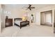 Spacious bedroom with wood furniture and large windows at 2112 Silent Echoes Dr, Henderson, NV 89044